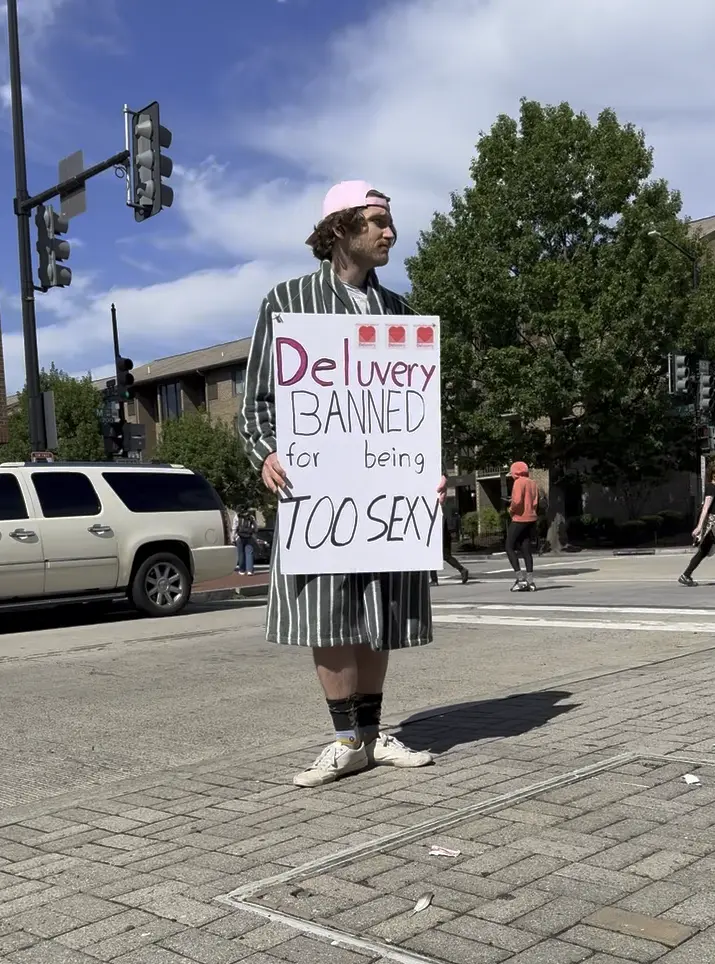 Deluvery protest sign at the DC Chamber summit entrance